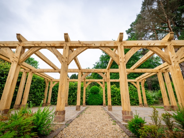 Oak framed pergola in rose garden